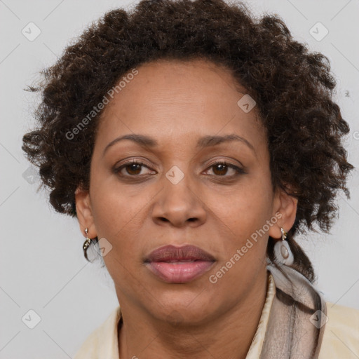 Joyful black adult female with short  brown hair and brown eyes