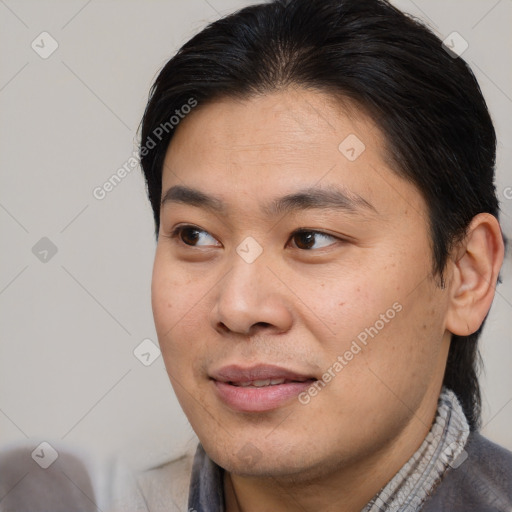 Joyful white young-adult male with short  black hair and brown eyes