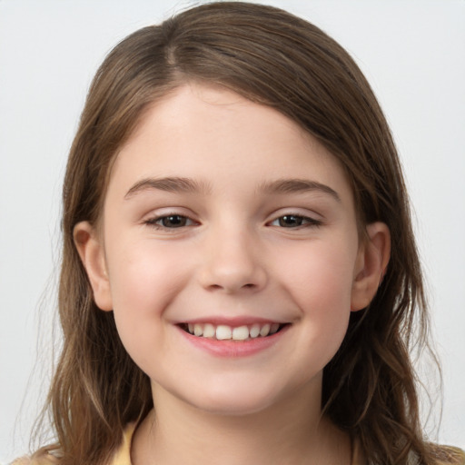 Joyful white child female with medium  brown hair and brown eyes