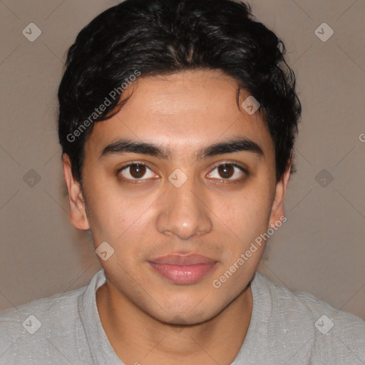 Joyful latino young-adult male with short  brown hair and brown eyes