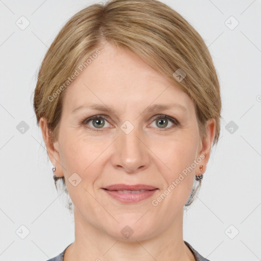 Joyful white adult female with medium  brown hair and grey eyes