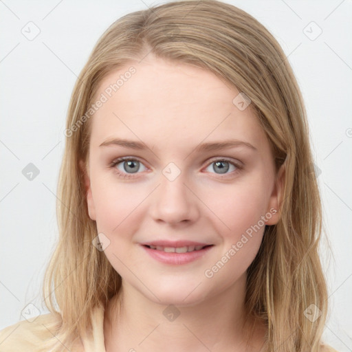 Joyful white young-adult female with long  brown hair and blue eyes