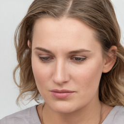 Neutral white young-adult female with medium  brown hair and grey eyes