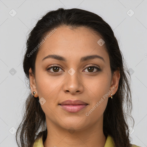 Joyful latino young-adult female with long  brown hair and brown eyes