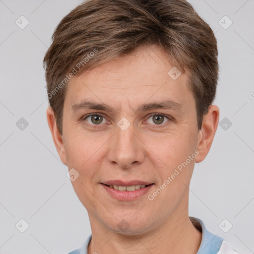 Joyful white adult male with short  brown hair and grey eyes