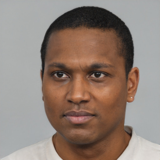 Neutral black young-adult male with short  black hair and brown eyes
