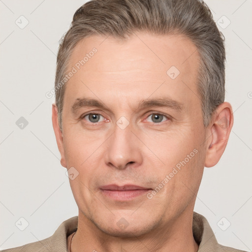 Joyful white adult male with short  brown hair and grey eyes