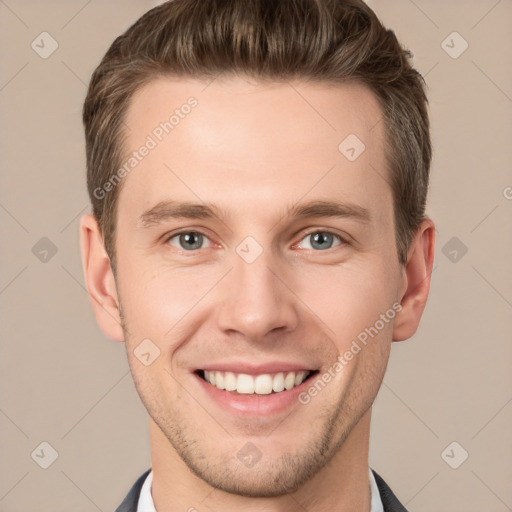 Joyful white young-adult male with short  brown hair and grey eyes