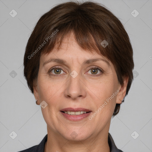 Joyful white adult female with short  brown hair and grey eyes