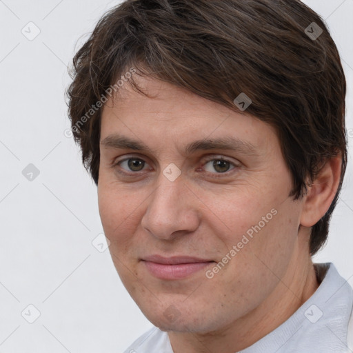 Joyful white adult male with short  brown hair and brown eyes