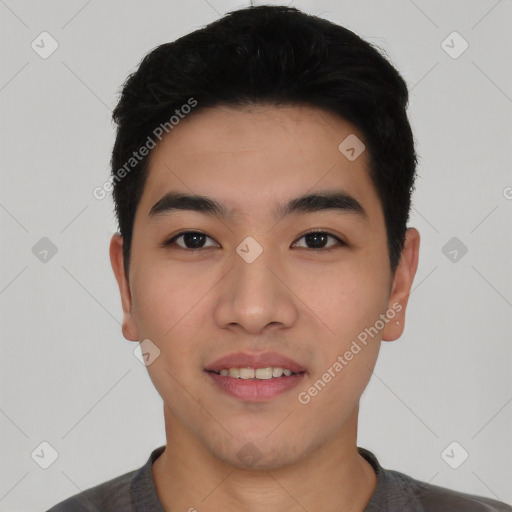 Joyful asian young-adult male with short  black hair and brown eyes