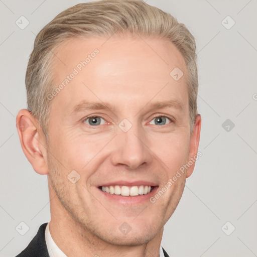 Joyful white adult male with short  brown hair and grey eyes