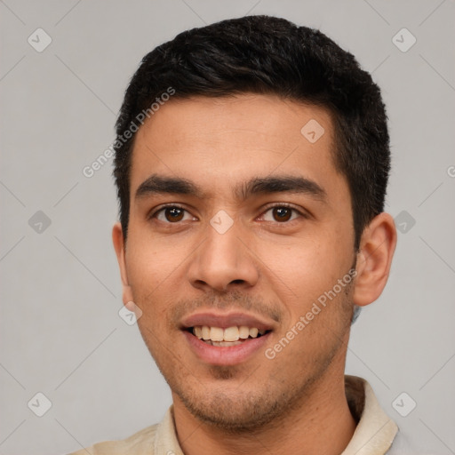 Joyful white young-adult male with short  black hair and brown eyes