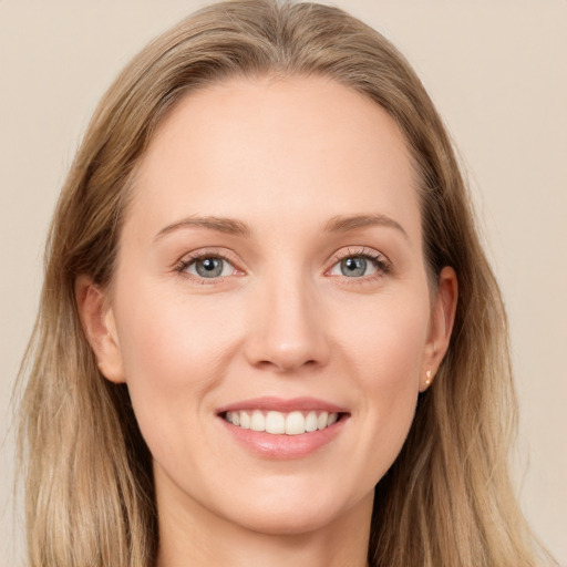 Joyful white young-adult female with long  brown hair and grey eyes