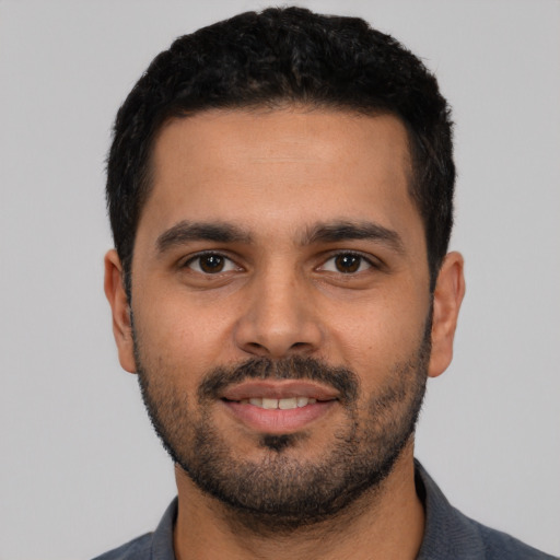 Neutral latino young-adult male with short  black hair and brown eyes
