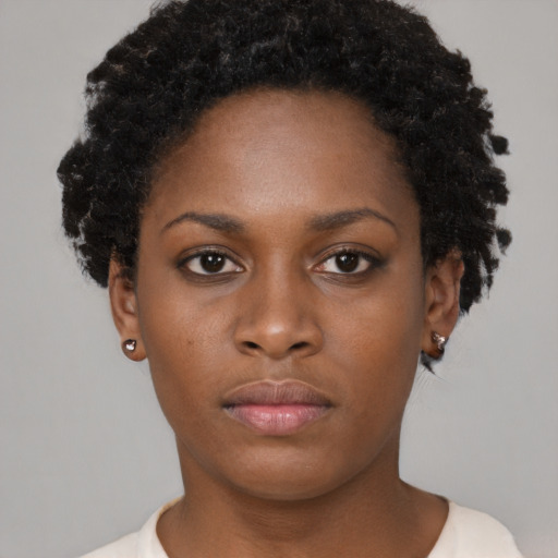 Neutral black young-adult female with short  brown hair and brown eyes