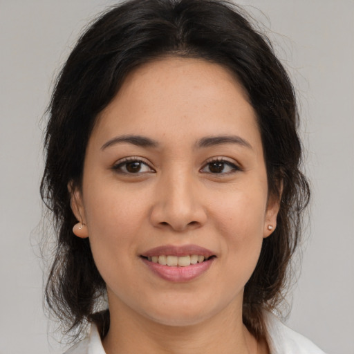 Joyful white young-adult female with medium  brown hair and brown eyes