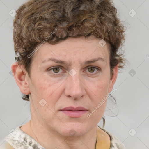 Joyful white adult female with medium  brown hair and blue eyes