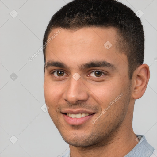 Joyful white young-adult male with short  brown hair and brown eyes