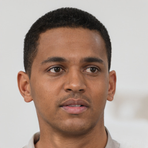 Neutral black young-adult male with short  brown hair and brown eyes