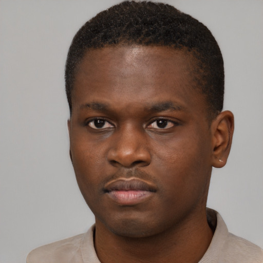 Neutral black young-adult male with short  brown hair and brown eyes