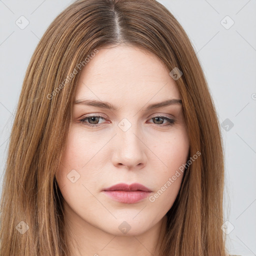 Neutral white young-adult female with long  brown hair and brown eyes