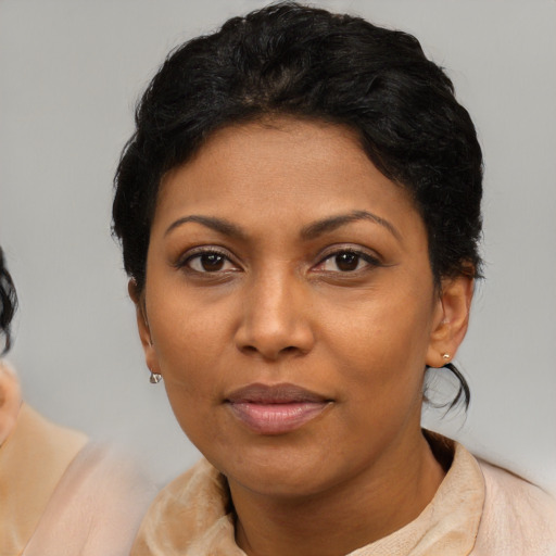 Neutral black adult female with medium  black hair and brown eyes