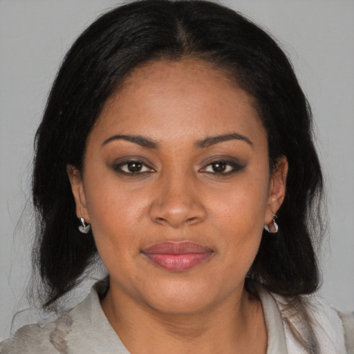 Joyful black young-adult female with medium  brown hair and brown eyes