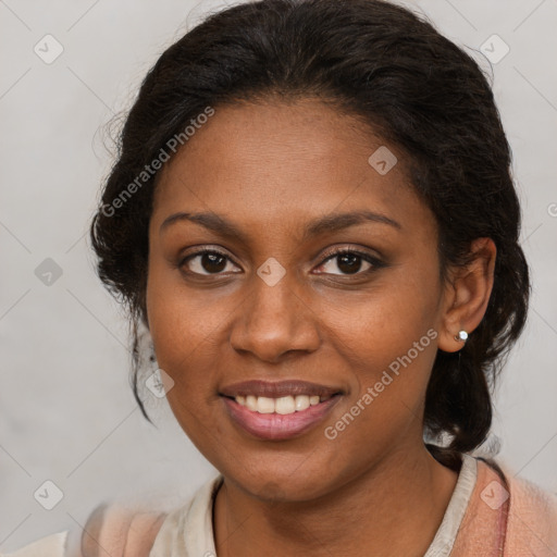 Joyful black young-adult female with medium  brown hair and brown eyes