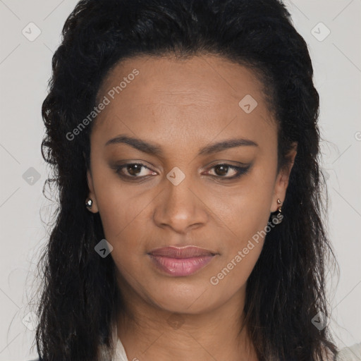 Joyful black young-adult female with long  brown hair and brown eyes