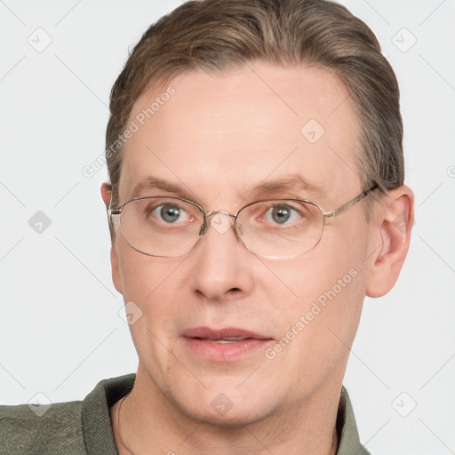 Joyful white adult male with short  brown hair and grey eyes