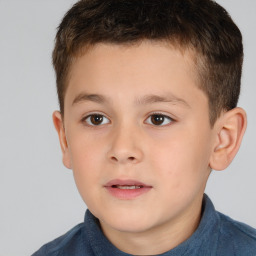 Joyful white child male with short  brown hair and brown eyes