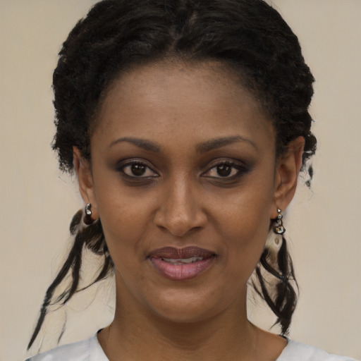 Joyful black young-adult female with medium  black hair and brown eyes