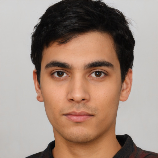 Neutral latino young-adult male with short  black hair and brown eyes
