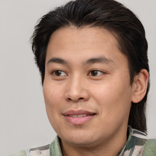 Joyful white young-adult male with medium  brown hair and brown eyes