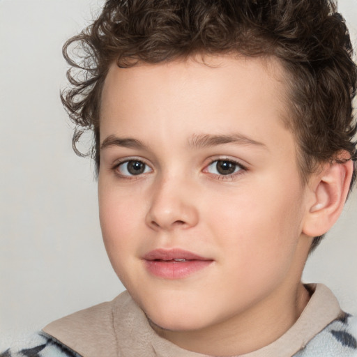 Joyful white child male with short  brown hair and brown eyes