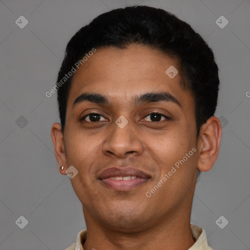 Joyful latino young-adult male with short  black hair and brown eyes