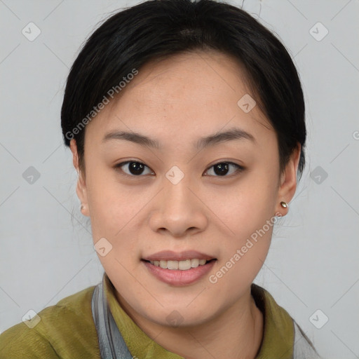 Joyful asian young-adult female with short  brown hair and brown eyes