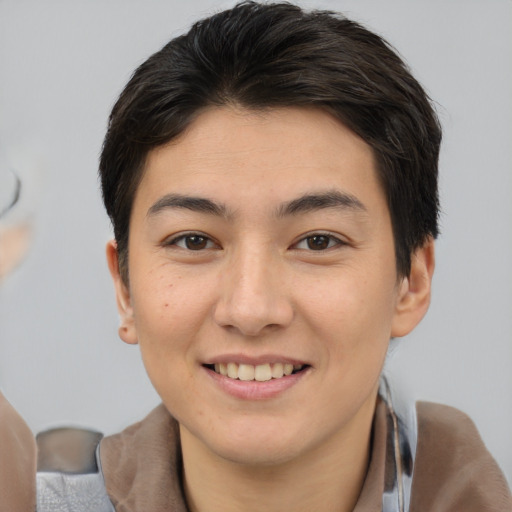 Joyful asian young-adult female with short  brown hair and brown eyes