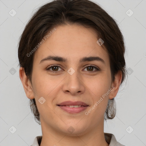 Joyful white young-adult female with short  brown hair and brown eyes