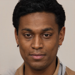 Joyful black young-adult male with short  black hair and brown eyes