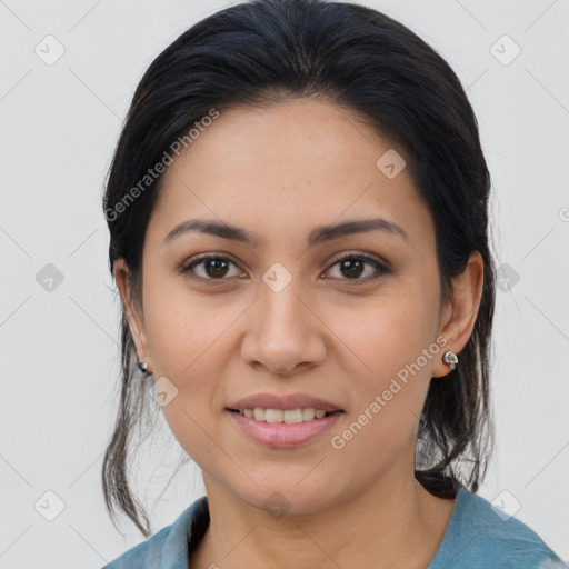 Joyful latino young-adult female with medium  brown hair and brown eyes