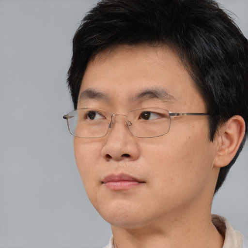 Neutral asian young-adult male with short  brown hair and brown eyes