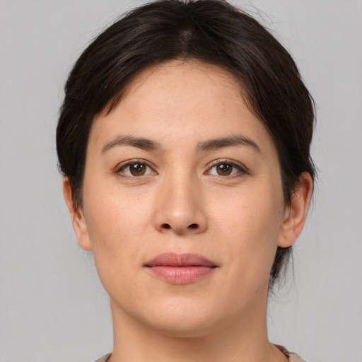 Joyful white young-adult female with medium  brown hair and brown eyes