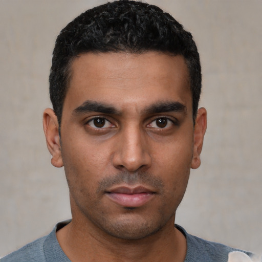 Neutral latino young-adult male with short  black hair and brown eyes