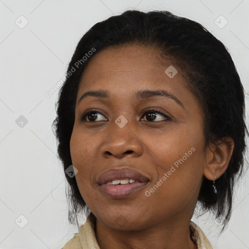 Joyful black young-adult female with medium  black hair and brown eyes