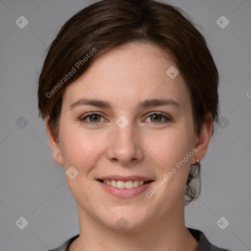 Joyful white young-adult female with medium  brown hair and grey eyes