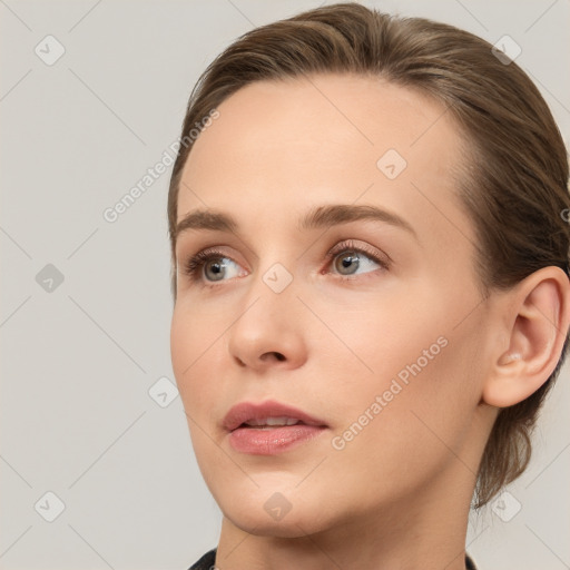 Neutral white young-adult female with medium  brown hair and brown eyes