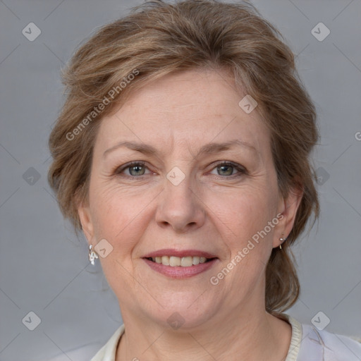 Joyful white adult female with medium  brown hair and grey eyes