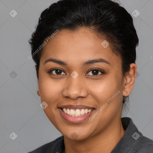 Joyful latino young-adult female with short  brown hair and brown eyes